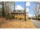Charming raised ranch home with a spacious deck and landscaped yard at 44 Browns Ct, Powder Springs, GA 30127