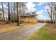 Two-story house with a long driveway and mature trees at 44 Browns Ct, Powder Springs, GA 30127