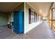 Spacious front porch with a blue locker and wooden floors at 44 Browns Ct, Powder Springs, GA 30127