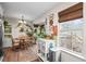 Eat-in kitchen with wood flooring, a round table, and access to a deck at 44 Browns Ct, Powder Springs, GA 30127