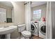 Bathroom with washer and dryer included at 44 Browns Ct, Powder Springs, GA 30127
