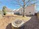 Large backyard with fire pit and wood chips ground cover at 585 Briarhurst Ct, Lawrenceville, GA 30046
