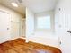 Bathroom featuring a soaking tub, a walk-in shower, and wood-look flooring at 585 Briarhurst Ct, Lawrenceville, GA 30046