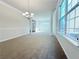 Spacious dining room featuring a chandelier and large windows at 585 Briarhurst Ct, Lawrenceville, GA 30046