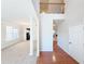 Two-story entryway with hardwood floors, views of dining room and staircase at 585 Briarhurst Ct, Lawrenceville, GA 30046