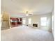 Spacious living room with hardwood and carpeted floors, fireplace and kitchen view at 585 Briarhurst Ct, Lawrenceville, GA 30046