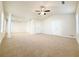 Spacious main bedroom with high ceilings, carpet, and multiple windows and closets at 585 Briarhurst Ct, Lawrenceville, GA 30046