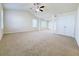 Large main bedroom with high ceilings, ceiling fan, carpet, and double doors to closet at 585 Briarhurst Ct, Lawrenceville, GA 30046