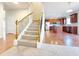 Modern staircase with wrought iron railings and carpet at 585 Briarhurst Ct, Lawrenceville, GA 30046