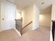 Upstairs hallway with staircase and carpet at 585 Briarhurst Ct, Lawrenceville, GA 30046