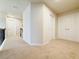 Upstairs hallway with two closets and carpet at 585 Briarhurst Ct, Lawrenceville, GA 30046