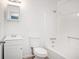 Clean bathroom with a tub, toilet and vanity at 6945 Brown S Dr, Fairburn, GA 30213