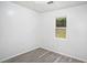 Small bedroom with grey flooring and a window at 6945 Brown S Dr, Fairburn, GA 30213