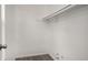Empty closet with wood shelving and grey flooring at 6945 Brown S Dr, Fairburn, GA 30213