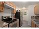 Kitchen with stainless steel appliances and wood cabinets at 6945 Brown S Dr, Fairburn, GA 30213