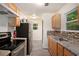 Kitchen with stainless steel appliances and wood cabinets at 6945 Brown S Dr, Fairburn, GA 30213