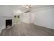 Spacious living room featuring hardwood floors and a fireplace at 6945 Brown S Dr, Fairburn, GA 30213