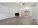 Spacious living room featuring hardwood floors and a fireplace at 6945 Brown S Dr, Fairburn, GA 30213