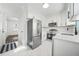 Modern kitchen with stainless steel appliances and white cabinets at 1831 Dresden Dr, Brookhaven, GA 30319