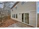 Private backyard with sliding glass door access and small patio at 3542 Brookstone Way, Union City, GA 30291