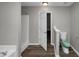 Main bathroom with toilet and shower, and access to another room at 3542 Brookstone Way, Union City, GA 30291