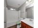 Clean bathroom with tub, wood vanity, and a large mirror at 3542 Brookstone Way, Union City, GA 30291