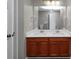 Double vanity bathroom with wood cabinets and quartz countertop at 3542 Brookstone Way, Union City, GA 30291