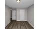Simple bedroom with wood flooring and two closets at 3542 Brookstone Way, Union City, GA 30291