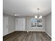 Bright dining room with gray walls and wood-look flooring at 3542 Brookstone Way, Union City, GA 30291
