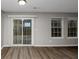 Bright dining room with sliding glass door and hardwood floors at 3542 Brookstone Way, Union City, GA 30291