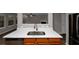 Kitchen island with double sink, stainless steel dishwasher, and wood cabinets at 3542 Brookstone Way, Union City, GA 30291