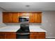 Kitchen with light wood cabinets and stainless steel range at 3542 Brookstone Way, Union City, GA 30291