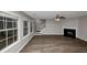 Living room with fireplace, wood-look floors, and neutral walls at 3542 Brookstone Way, Union City, GA 30291