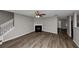 Living room with fireplace and wood-look floors at 3542 Brookstone Way, Union City, GA 30291