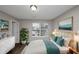 Main bedroom with large window, dresser, and a comfortable bed at 3542 Brookstone Way, Union City, GA 30291