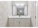 Modern bathroom with white vanity and large mirror at 1129 Gate Post Ln, Lawrenceville, GA 30044