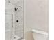 Bathroom with a frameless glass shower and marble tile at 1129 Gate Post Ln, Lawrenceville, GA 30044