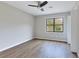 Spacious bedroom with hardwood floors and large window at 1129 Gate Post Ln, Lawrenceville, GA 30044