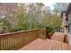 Wooden deck overlooking a wooded backyard at 1129 Gate Post Ln, Lawrenceville, GA 30044