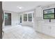 Open concept kitchen with white cabinets, stainless steel appliances and bay window at 1129 Gate Post Ln, Lawrenceville, GA 30044