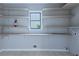 Laundry room with ample shelving for storage at 1129 Gate Post Ln, Lawrenceville, GA 30044