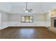 Bright living room with hardwood floors, fireplace, and high ceilings at 1129 Gate Post Ln, Lawrenceville, GA 30044