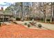 Beautiful brick patio and fountain in private, wooded backyard oasis at 6355 Indian Acres Trl, Tucker, GA 30084