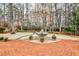 Beautiful brick patio and fountain in private, wooded backyard oasis at 6355 Indian Acres Trl, Tucker, GA 30084