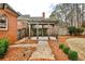 Cozy backyard with brick patio and pergola, ideal for outdoor relaxation at 6355 Indian Acres Trl, Tucker, GA 30084