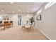 Finished basement with a dining area, seating, neutral walls, and carpeted floors at 6355 Indian Acres Trl, Tucker, GA 30084