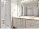 Well lit bathroom offers double vanity, large mirror, tile floor, and toilet at 6355 Indian Acres Trl, Tucker, GA 30084