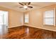 Bedroom features hardwood floors, two windows, and natural light at 6355 Indian Acres Trl, Tucker, GA 30084