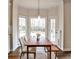 Cozy dining area with a large window looking out onto a private backyard at 6355 Indian Acres Trl, Tucker, GA 30084