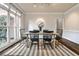 This formal dining room has hardwood floors, wainscoting and views of the side yard at 6355 Indian Acres Trl, Tucker, GA 30084